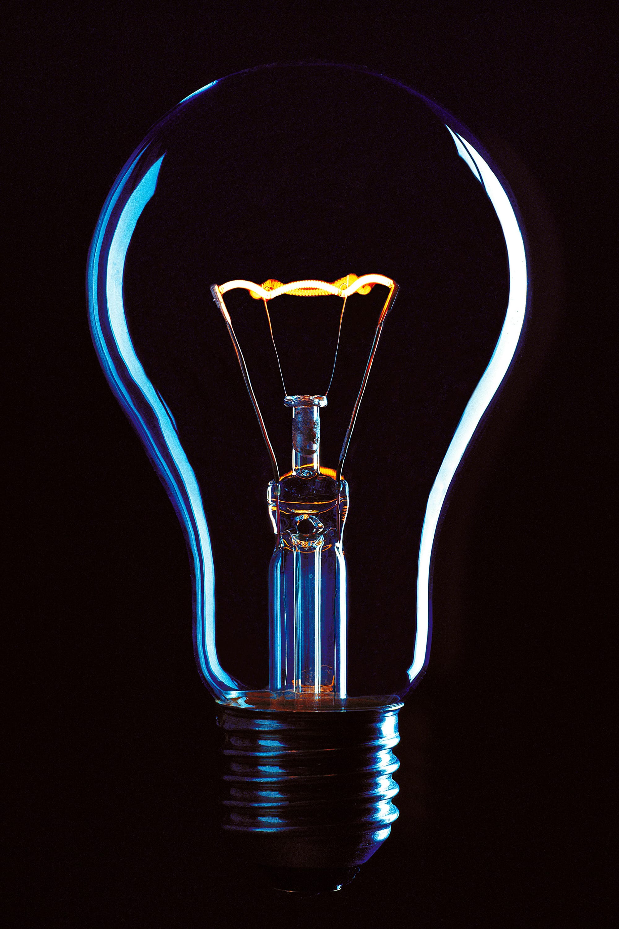 a light bulb hanging from a black wire