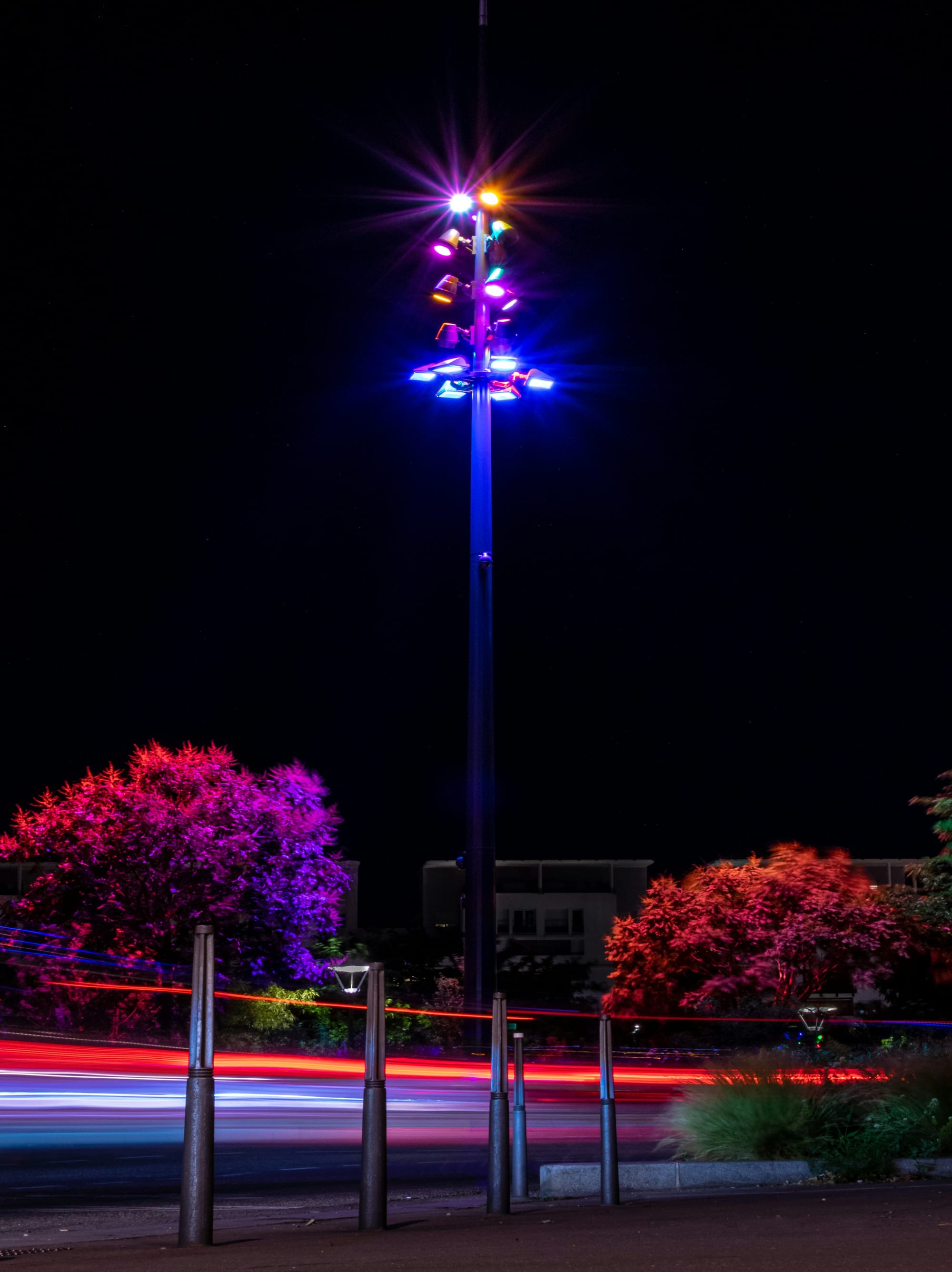 a carnival with a ferris wheel at night
