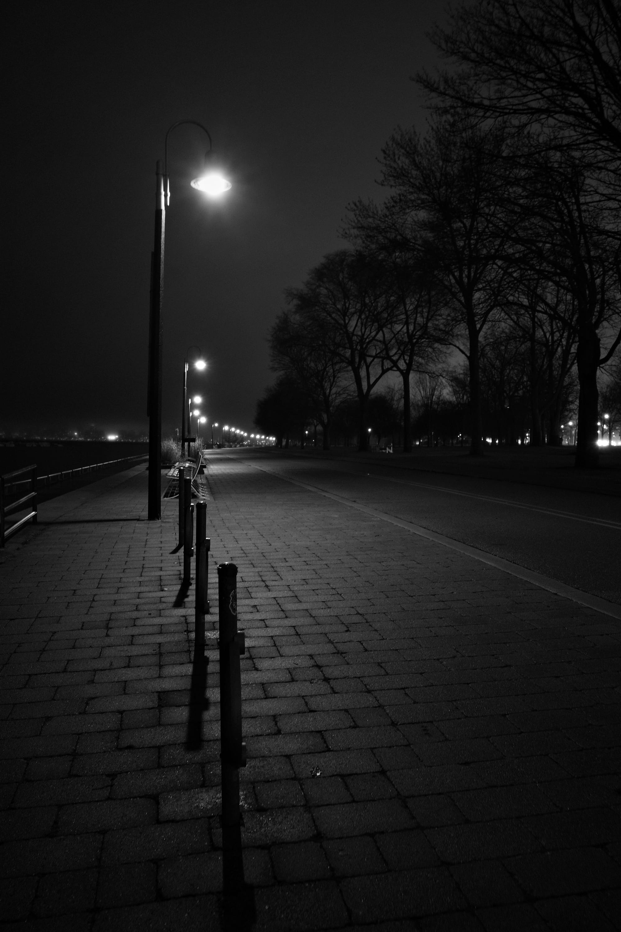 Streetlights and warning lights against a cloudy sky